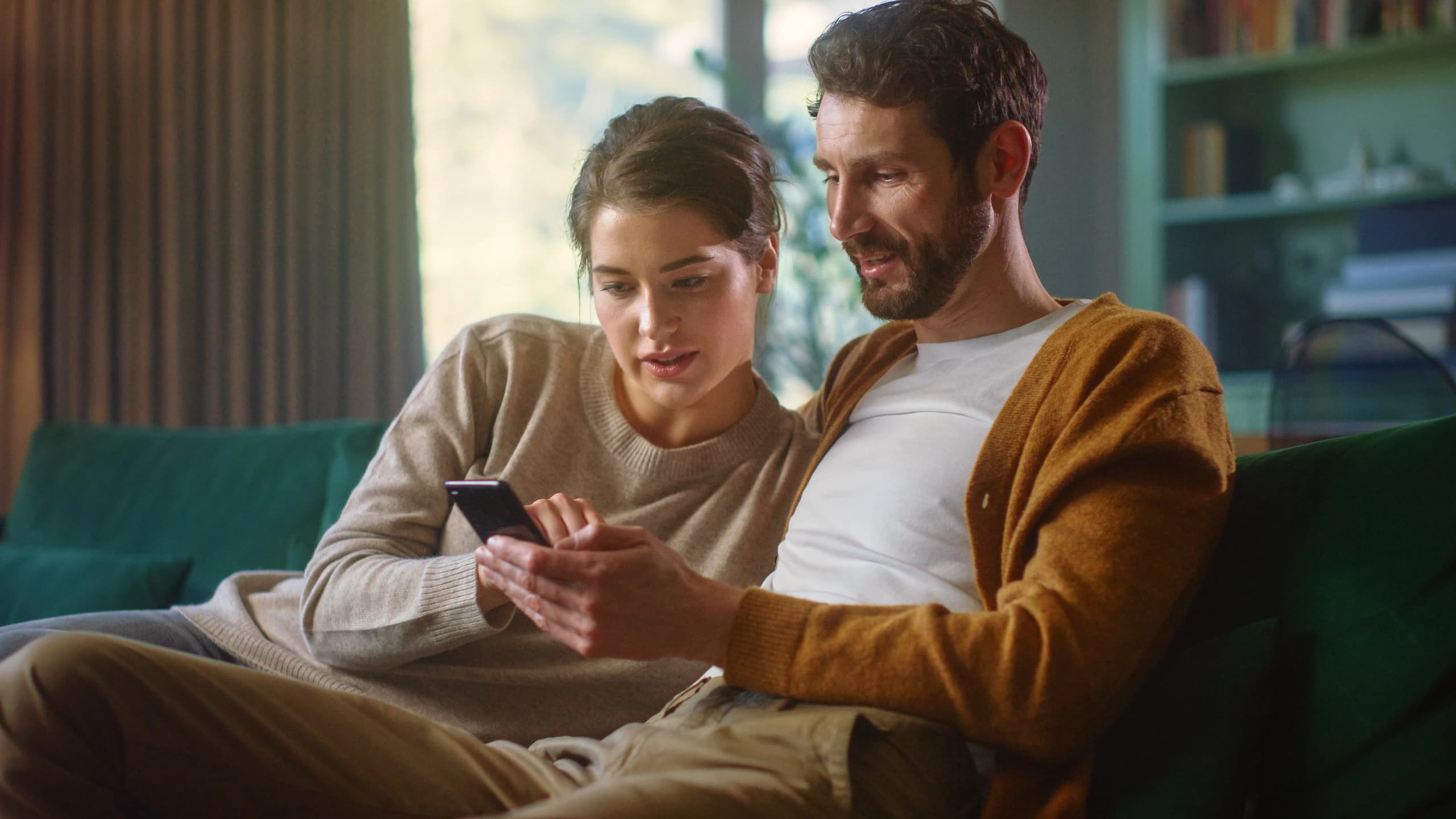 Couple looking at phone together